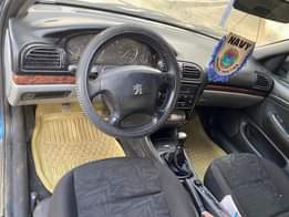 A picture of Very clean 406 manual with complete original papers and duty