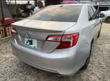 A picture of Toyota Camry 2014 Pure firstbody Clean in and out Toks