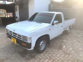 A picture of Nissan pickup full Ac manual transmission petrol new tires million