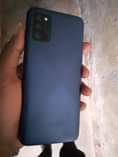 A picture of Samsung galaxy a02s simple crack at the corner