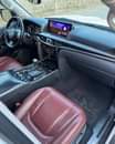 A picture of 2016 Lexus LX570 in pearl white on red interior