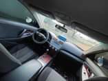 A picture of Sharp and neat 2010 Toyota Camry sport. Everything is in