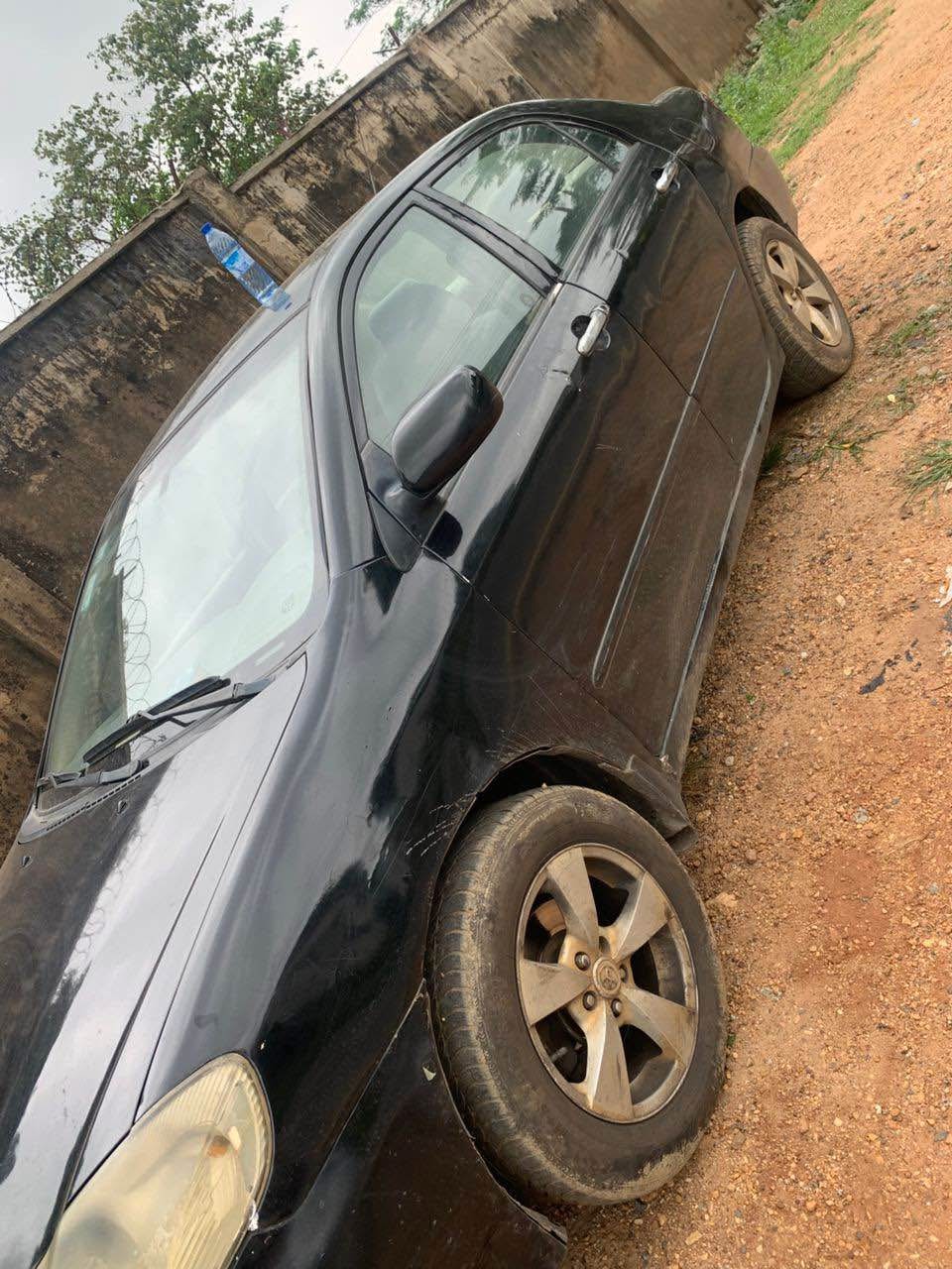 A picture of Toyota Corolla 2003 partly only the bumber is rough Ac