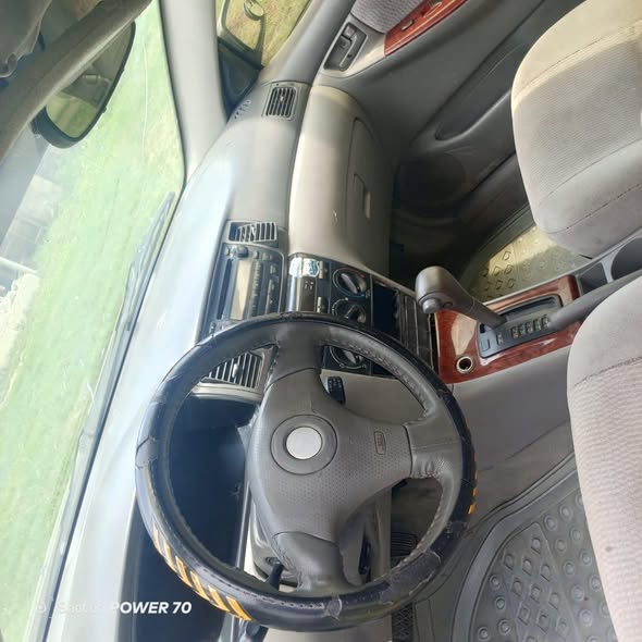 A picture of Sallah Awoof 2007 Corolla engine gear and AC is working