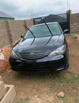 A picture of Toyota camry black ibadan 4plug