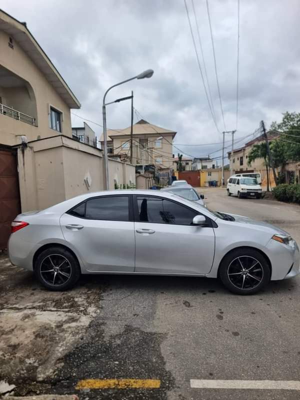 A picture of NEW ARRIVAL FOREIGN USED 2014 COROLLA With Rev Camera Bluetooth