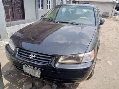 A picture of Toyota Camry tiny light with clean engine gear and AC