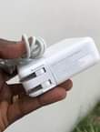 A picture of Original used MacBook charger 85w. Available Wholesale and retail