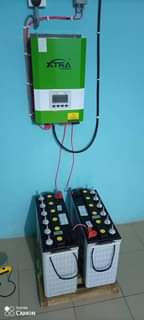 A picture of 2kva 24v Xtra power inverter and 2 luminous battery