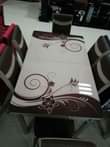 A picture of Modern Adjustable glass dining Tables with 6 seater at affordable
