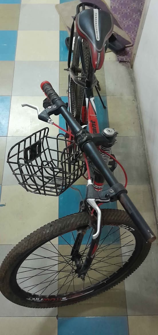 A picture of Rarely used bicycle In good condition Red black colour