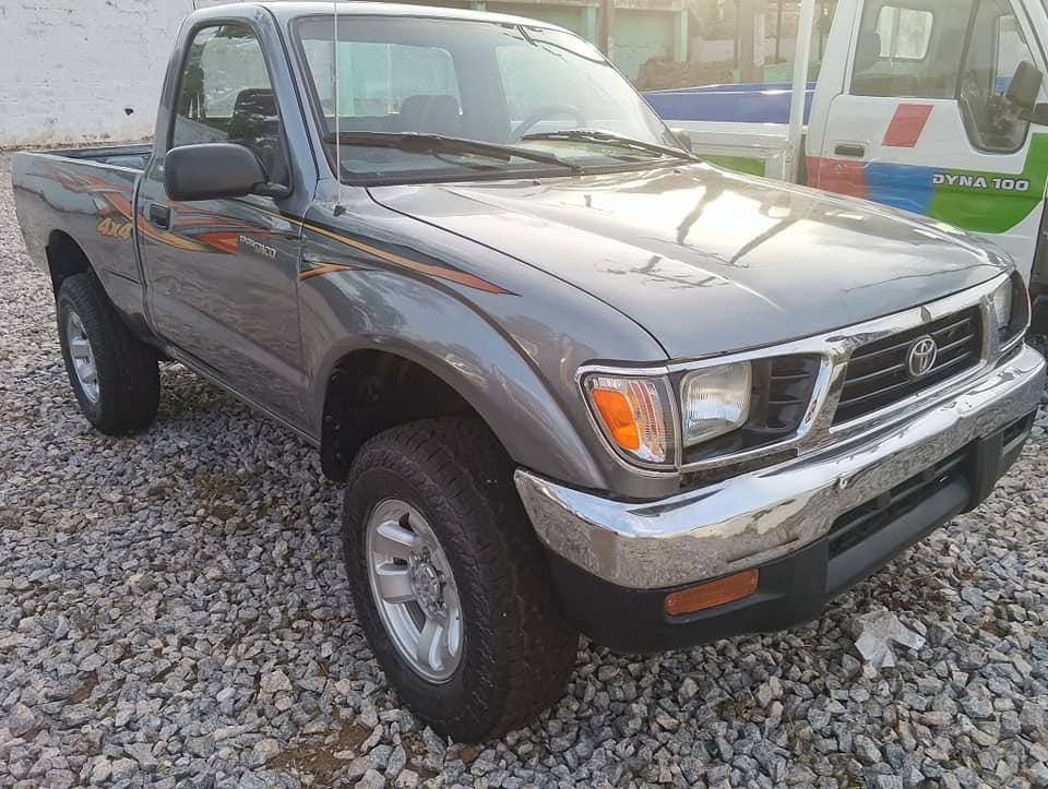 A picture of TOYOTA TACOMA 1998 MODEL WITH COMPLETE ORIGINAL PAPERS ENGINE AND