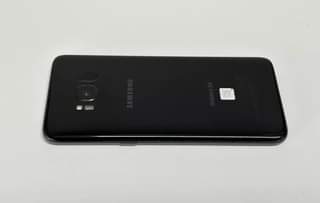 A picture of Sumsung s8 phones available in stock with a charger as