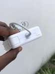 A picture of Original used MacBook charger 85w. Available Wholesale and retail