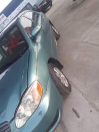 A picture of Awooof Toyota corolla 2004 model Engine and gear ok AC
