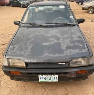 A picture of Mazda 323 available for sale in osogbo complete first body