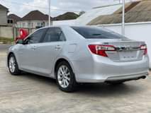 A picture of Toks XLE Toyota Camry 2014 model leather seats and Formica