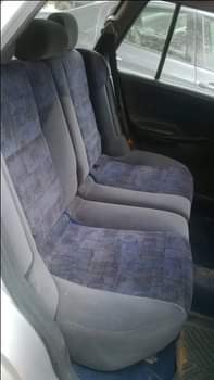A picture of Fabric seat Manual gear Tapping glass Car situated in the