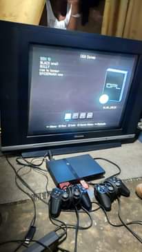A picture of PS2 FULLSET with 5games and 29 inchez Hisense kibuto tv
