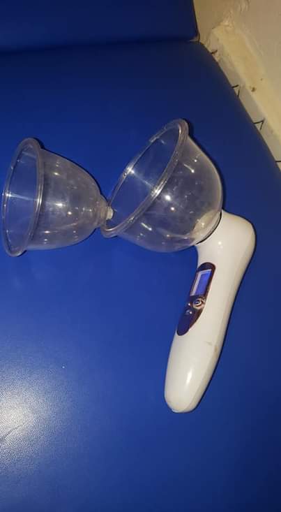 A picture of Massage bed Facial steamer and breast vacuum