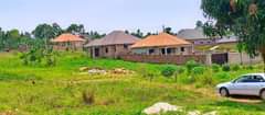 A picture of Muje Mbaguze Plots Lands Houses land surveying and Title processing