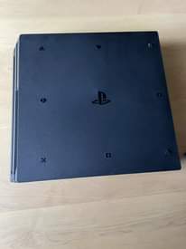 A picture of playstation 4 pro with 1 controller and free gta v