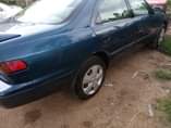 A picture of Toyota Camry tiny light very clean interior sharp body engine