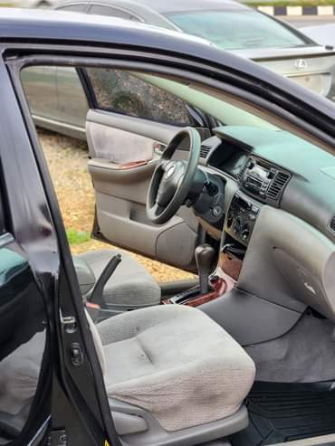 A picture of EXTREMELY SHARP PRE OWNED 2005 TOYOTA COROLLA LE CLEAN INTERIOR