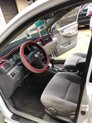 A picture of DEALER S Market Toyota Corolla 2004 Engine has little top