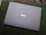 A picture of Asus laptop slim body comes with mouse
