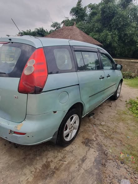 A picture of Mazda 5 3 row seat money needed algently good engine