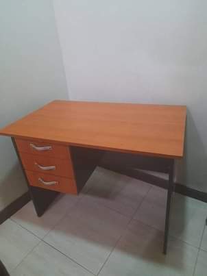 A picture of Sofa clothes rack and cylinder