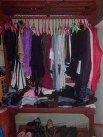 A picture of Sofa clothes rack and cylinder