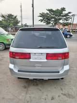 A picture of URGENT SALE Foreign used 02 Honda Odyssey fabrics 3rows power