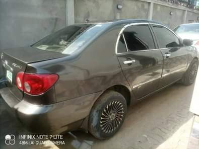 A picture of Toyota corolla 2004 model With sharpest interior nd indomie rims