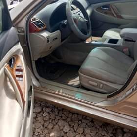 A picture of NEATLY USED 2010 CAMRY WITH COMPLETE ORIGINAL PAPERS AC PERFECTLY