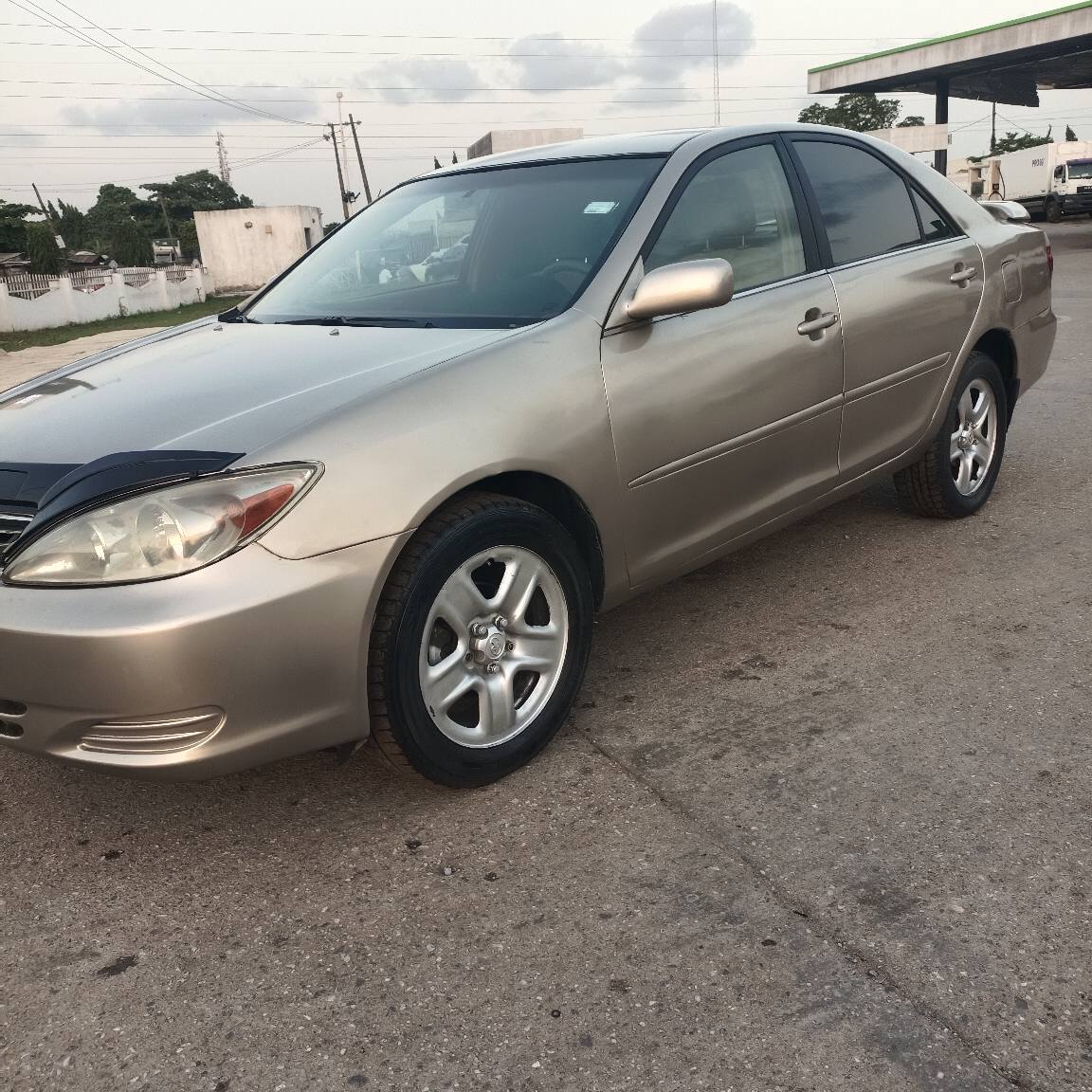 A picture of Toyota Camry 9ja used baked on first body everything is