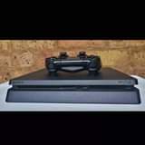 A picture of Playstation 4 Slim complete with games full package ni kuchomeka