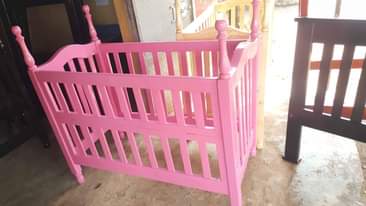 A picture of Baby crib in pink