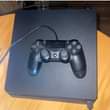 A picture of Playstation 4 Slim complete with games full package ni kuchomeka