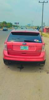 A picture of Ford edge 2008 model with Android screen Reverse camera Papers