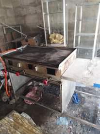 A picture of Jiko la gesi la kuoka chapati na mtungi wa gesi