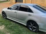 A picture of Sharp and neat 2010 Toyota Camry sport. Everything is in
