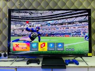 A picture of Sony PlayStation 4 slim 500gb with 2 game controllers and