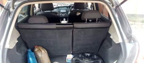 A picture of Nissan tiida on sale 55000 negotiable it needs 2coils and