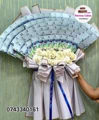 A picture of  flowerbouquet moneyhampers balloons cakes surprisepackages gifts deliveryavailable kampalaUg