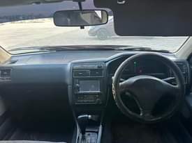 A picture of TOYOTA CARINA TI 1490 CC BEI 5 5 MIL HAINA