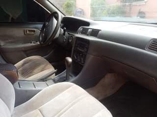 A picture of Toyota Camry pencil light untampered engine and gear sweet interior