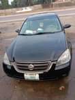A picture of Nissan altima in good condition 4cylinder everything is working first