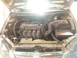 A picture of Toyota Corolla 2003 engine smoking